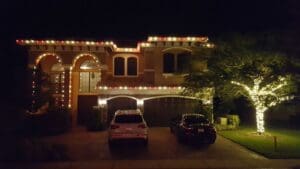 Roofline and tree Christmas light installation on home by Christmas Decor in Boynton Beach