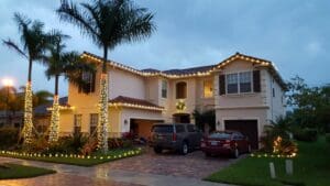 Residential Christmas light installation with palm trees by Christmas Decor in Boynton Beach