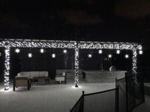 Outdoor patio Christmas lights and star decorations by Christmas Decor in Boynton Beach
